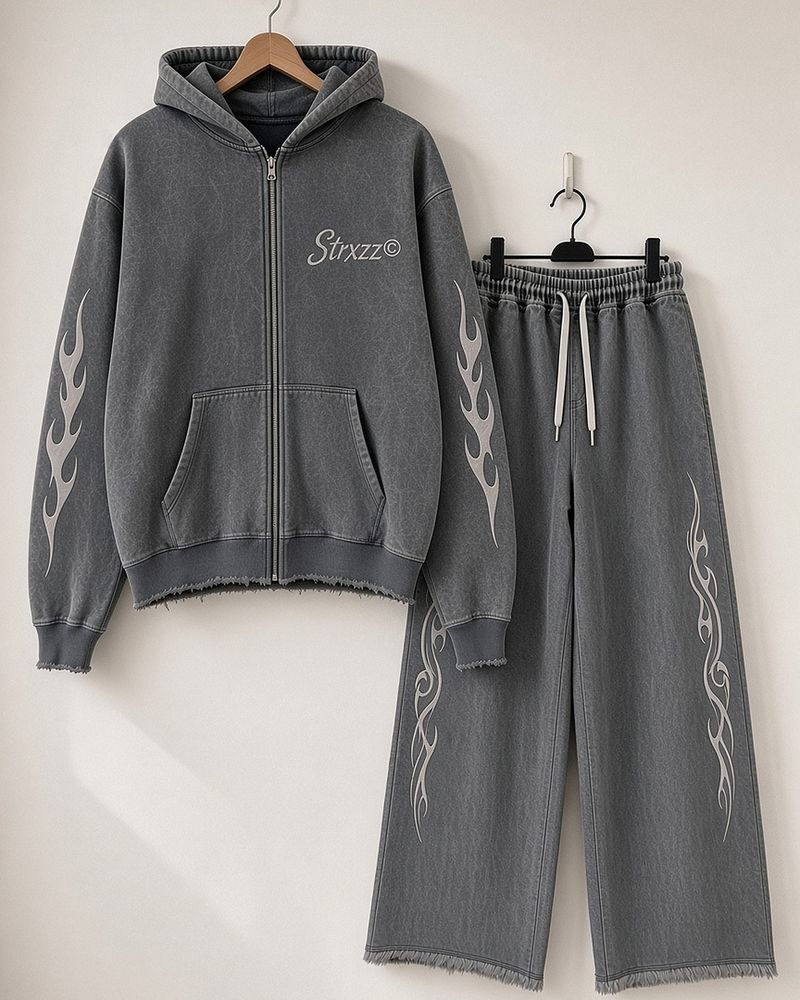 Strxzz Exclusive drop washed charcoal zip hoodie and baggy joggers, hanging together on a white wall